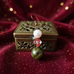 Perle blanche, facette ambre, vert